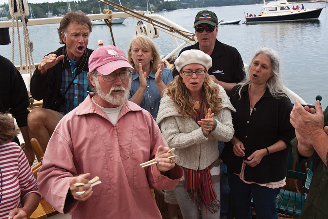 group singing on a boat
