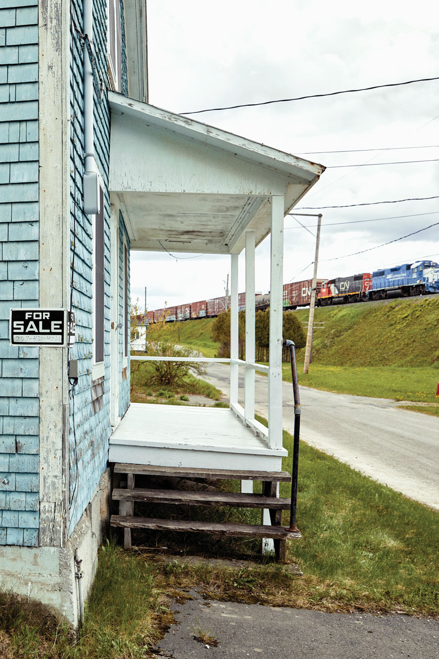 A Canadian National Railway train passes atop the berm in front of Scot Bubier’s camp, the northernmost house east of the Mississippi.