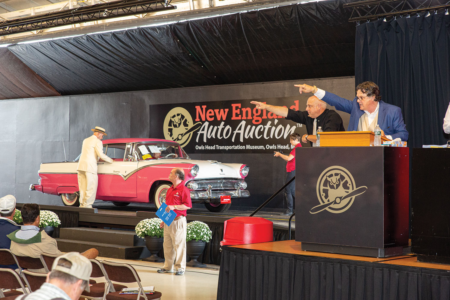 John Bottero and Kaja Veilleux lead the New England Auto Auction for Owls Head Transportation Museum.